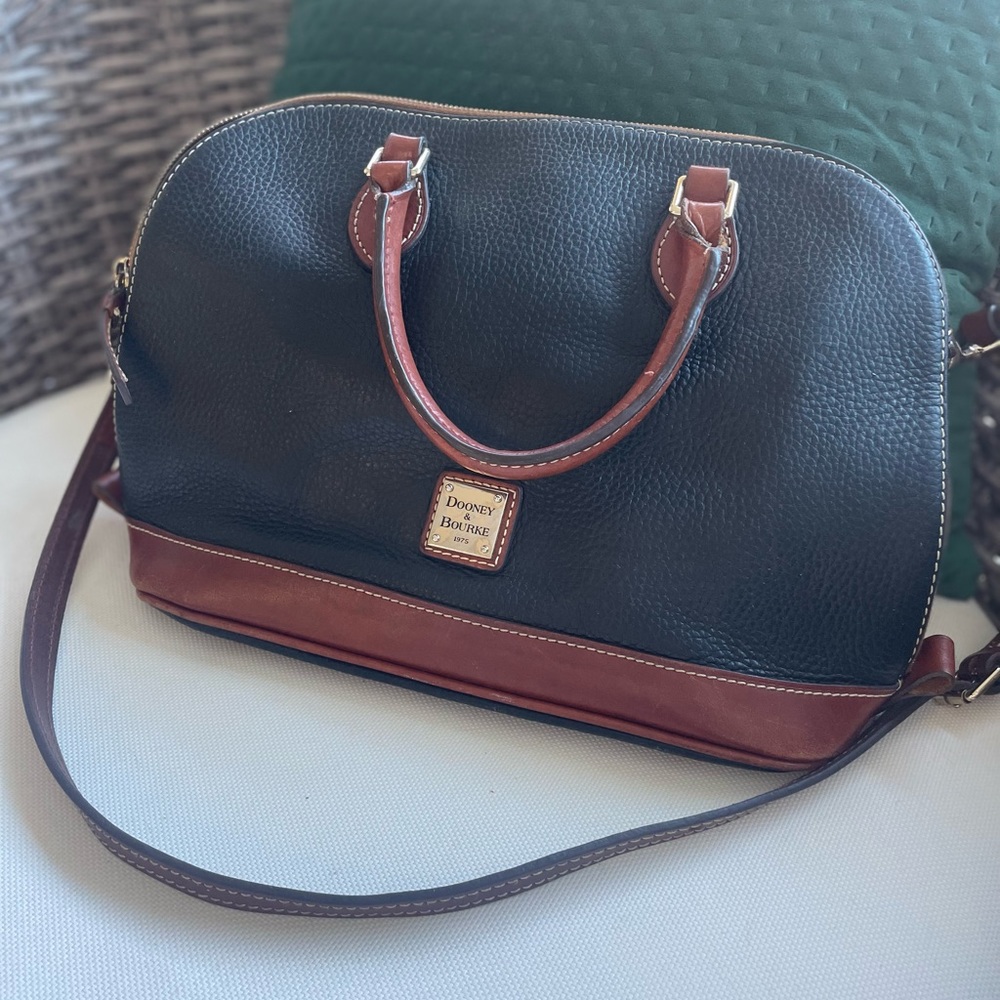 Black purse with red interior.